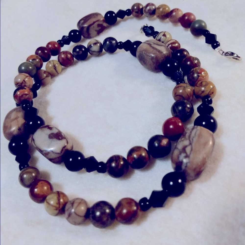 Hand assembled necklace made with natural stone beads and crystal's.